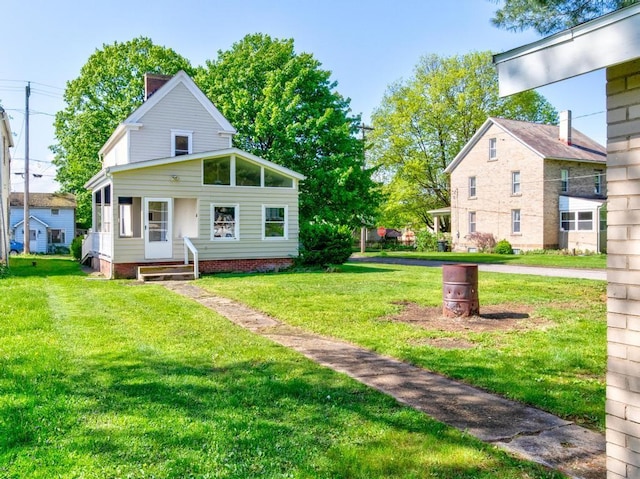 411 4th St, Darlington, PA 16115 - view of front facade with a front lawn and a chimney
