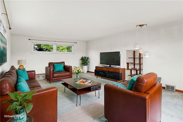 living area featuring baseboards