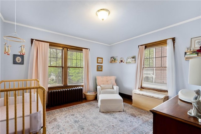 16 Morgan Ave E, Washington Boro, PA 15301 - bedroom with radiator heating unit, ornamental molding, wood finished floors, a nursery area, and baseboards