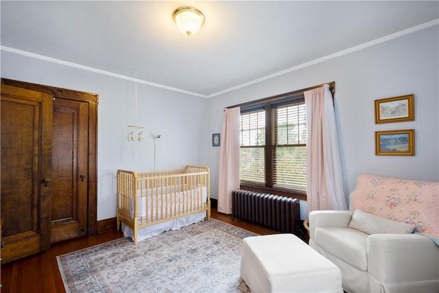 16 Morgan Ave E, Washington Boro, PA 15301 - bedroom with radiator heating unit, ornamental molding, and dark wood finished floors
