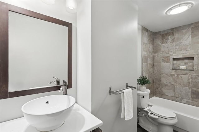 full bath with toilet, vanity, and shower / washtub combination