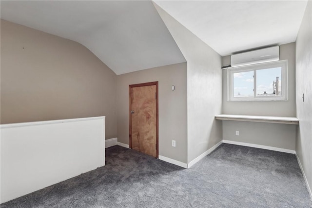 bonus room featuring carpet flooring, lofted ceiling, a wall mounted air conditioner, and baseboards