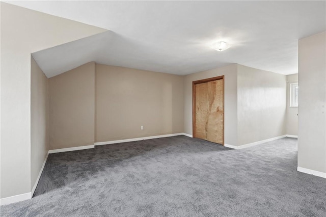 additional living space with carpet and baseboards
