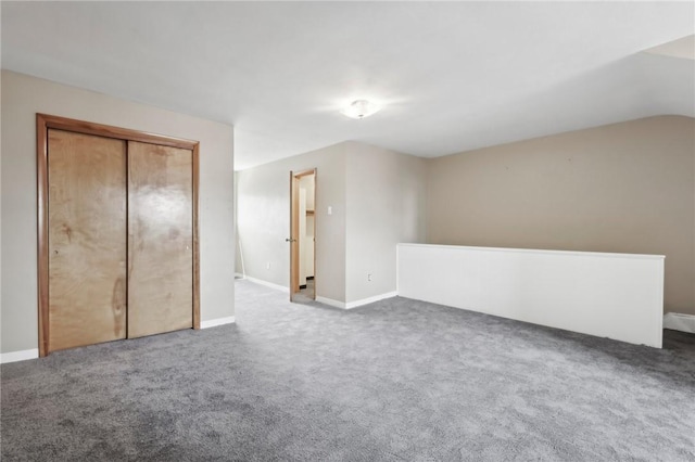 additional living space featuring carpet and baseboards