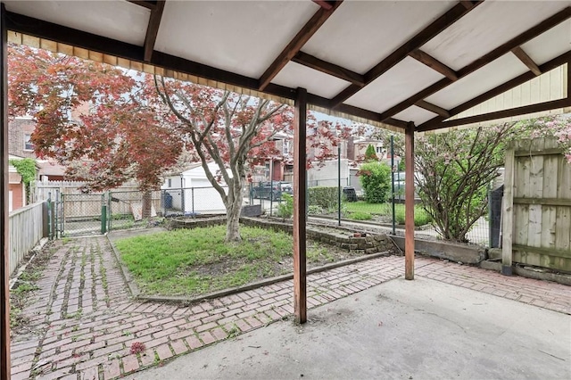 view of patio / terrace featuring a gate and fence