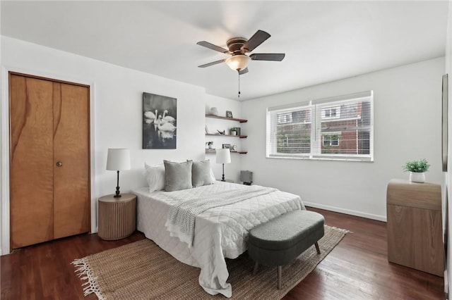bedroom featuring wood finished floors, ceiling fan, and baseboards