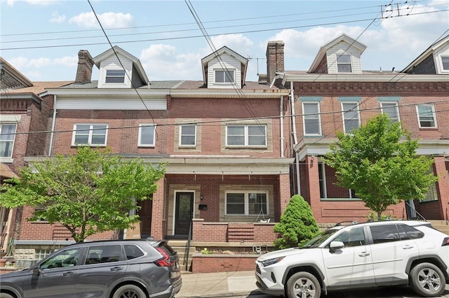 view of property featuring brick siding