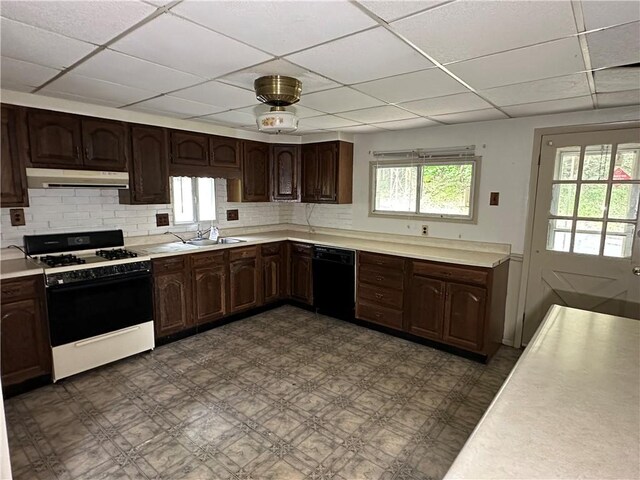 15013 Murrysville Rd, Trafford, PA 15085 - kitchen with white range with gas cooktop, dishwasher, a drop ceiling, under cabinet range hood, and dark floors