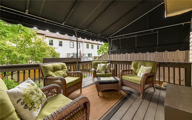 wooden terrace featuring an outdoor living space