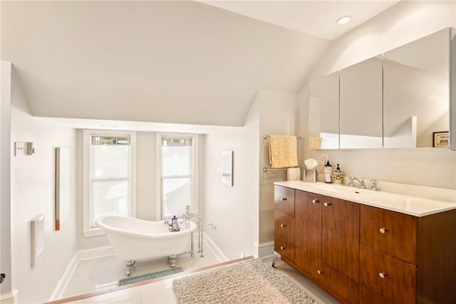 301 Meyers Ave, Meyersdale Boro, PA 15552 - full bathroom featuring baseboards, vaulted ceiling, a soaking tub, vanity, and tile patterned flooring
