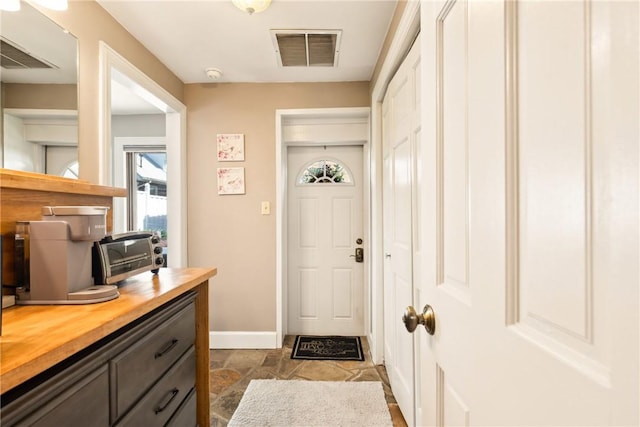 301 Meyers Ave, Meyersdale Boro, PA 15552 - doorway with baseboards and dark stone finish flooring