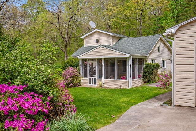 192 Wilkins Hollow Rd, Addison Twp, PA 15411 - rear view of property with a shingled roof, a sunroom, and a yard