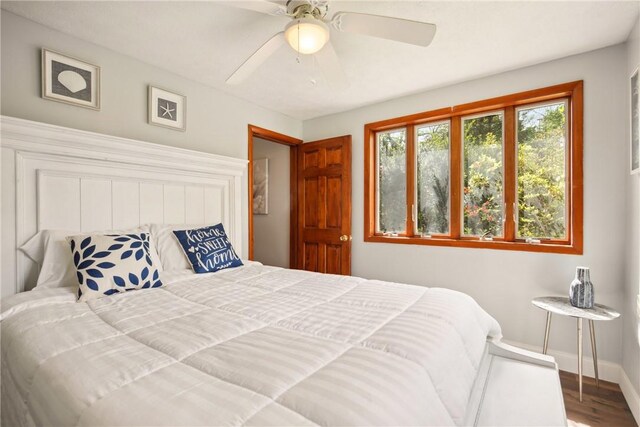 192 Wilkins Hollow Rd, Addison Twp, PA 15411 - bedroom with baseboards, wood finished floors, and ceiling fan