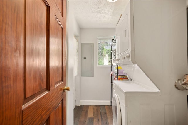 192 Wilkins Hollow Rd, Addison Twp, PA 15411 - laundry room featuring stacked washer and clothes dryer, electric panel, a textured ceiling, dark wood-style flooring, and baseboards