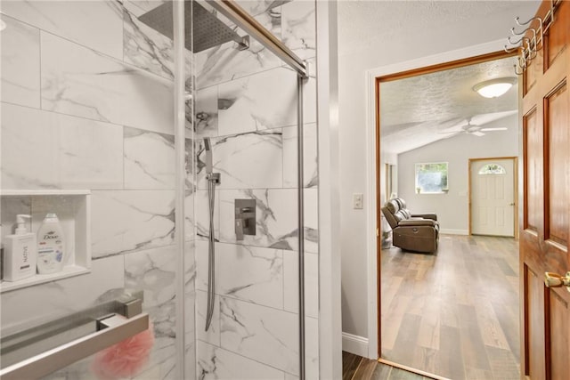 192 Wilkins Hollow Rd, Addison Twp, PA 15411 - full bathroom featuring a marble finish shower, a ceiling fan, wood finished floors, lofted ceiling, and baseboards