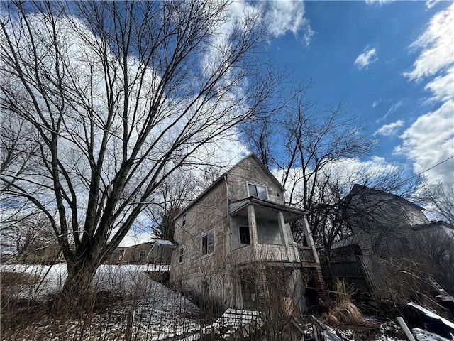 792 11th St, Pitcairn, PA 15140 - view of snowy exterior with fence