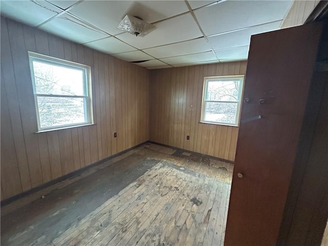 792 11th St, Pitcairn, PA 15140 - spare room with hardwood / wood-style flooring, baseboards, and wooden walls