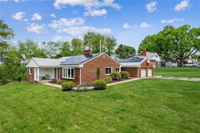 4625 Doverdell Dr, Whitehall, PA 15236 - view of front of property with brick siding, a chimney, a front yard, and solar panels