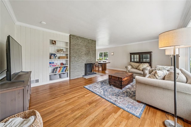 4625 Doverdell Dr, Whitehall, PA 15236 - living room featuring crown molding, wood finished floors, a fireplace, baseboards, and built in shelves
