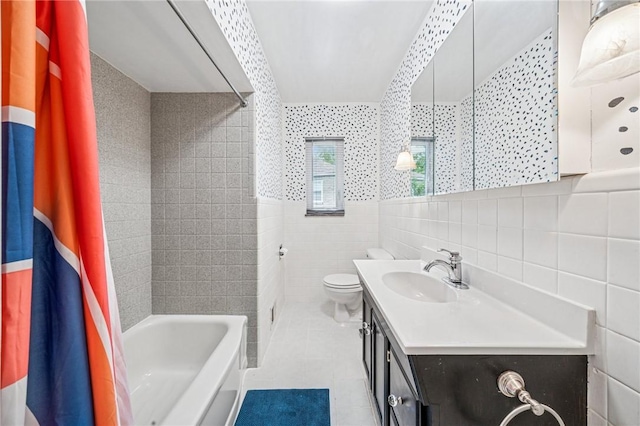 4625 Doverdell Dr, Whitehall, PA 15236 - bathroom with tile walls, tile patterned floors, vanity, toilet, and shower / washtub combination
