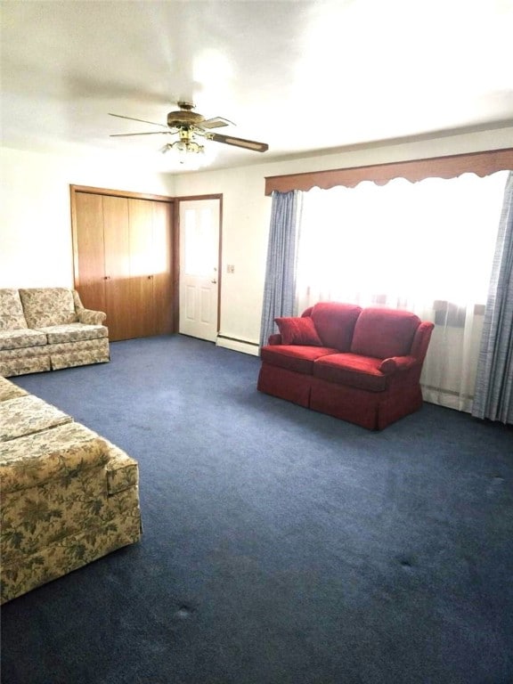 living area featuring a baseboard radiator, carpet, and ceiling fan