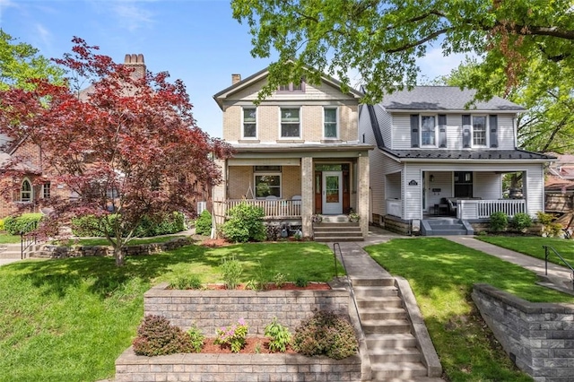 view of front of house with a porch and a front yard