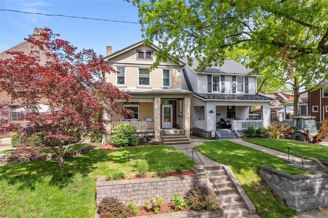 view of front of property with a porch and a front lawn
