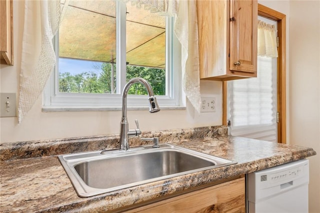 kitchen view of dishwasher and a sink