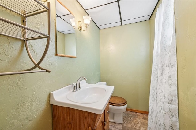 bathroom with toilet and vanity