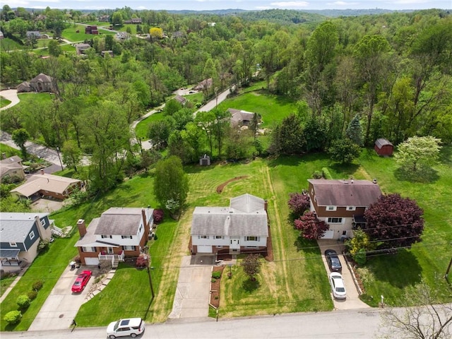 aerial view of residential area with a heavily wooded area