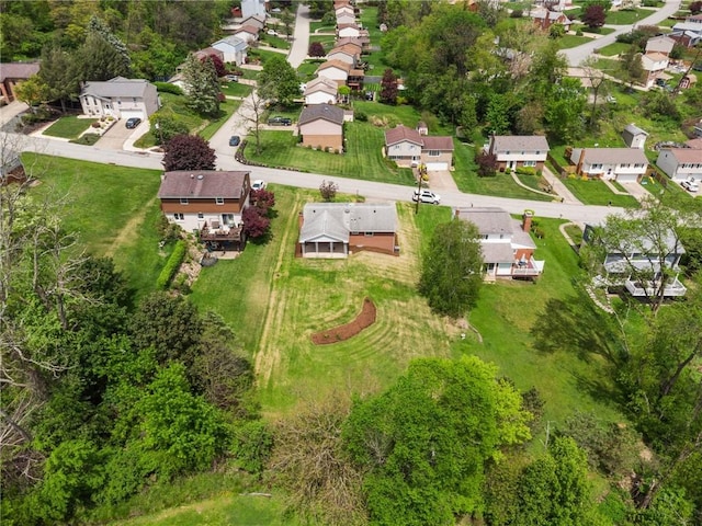 aerial view of property and surrounding area with nearby suburban area