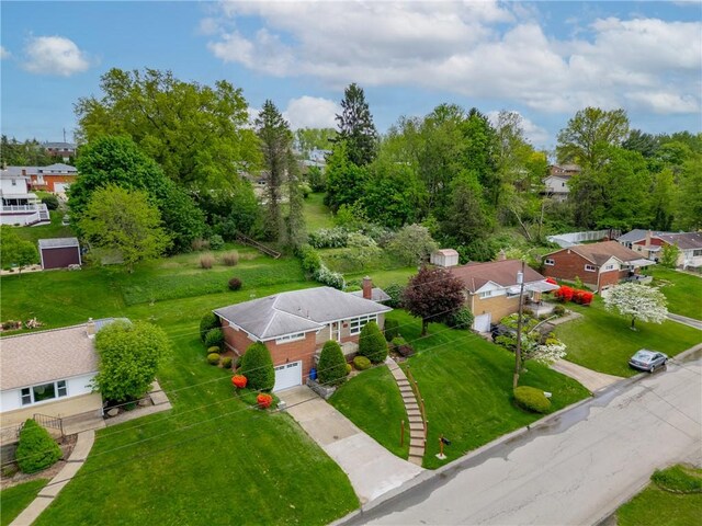 aerial view of residential area with a tree filled landscape