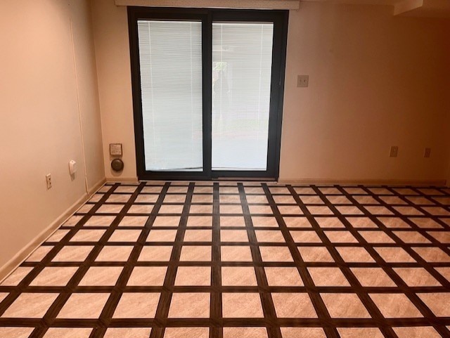 empty room featuring baseboards
