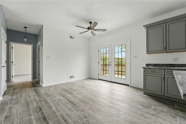 958 Cliff Mine Rd, Coraopolis, PA 15108 - unfurnished dining area with a ceiling fan, wood finished floors, baseboards, and french doors