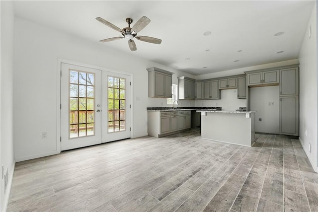 958 Cliff Mine Rd, Coraopolis, PA 15108 - kitchen featuring gray cabinets, french doors, light wood-type flooring, and a ceiling fan