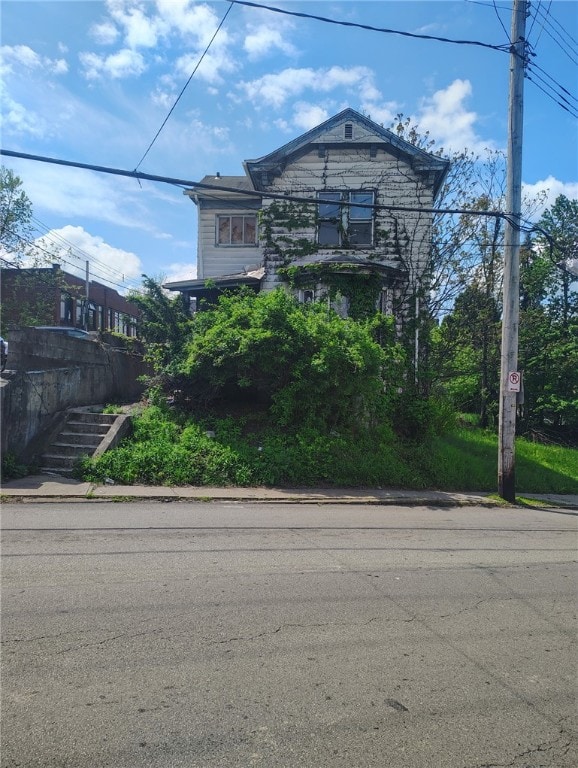 view of front of property with stairway