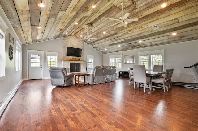 10 Chestnut Ln, Finleyville, PA 15332 - living area with baseboard heating, hardwood / wood-style flooring, a ceiling fan, a stone fireplace, and wood ceiling