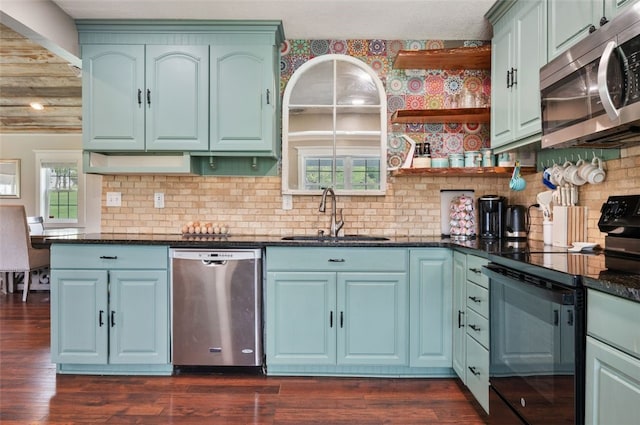10 Chestnut Ln, Finleyville, PA 15332 - kitchen featuring appliances with stainless steel finishes, a sink, open shelves, and dark wood-type flooring