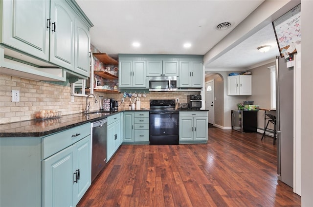 10 Chestnut Ln, Finleyville, PA 15332 - kitchen with stainless steel appliances, a sink, decorative backsplash, open shelves, and dark wood-style floors
