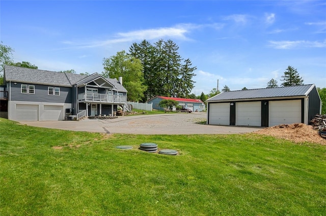 10 Chestnut Ln, Finleyville, PA 15332 - view of green lawn with stairway, a deck, and a detached garage