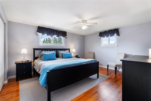 117 Teal Dr, Kennedy Twp, PA 15136 - bedroom featuring multiple windows, baseboards, and light wood-type flooring
