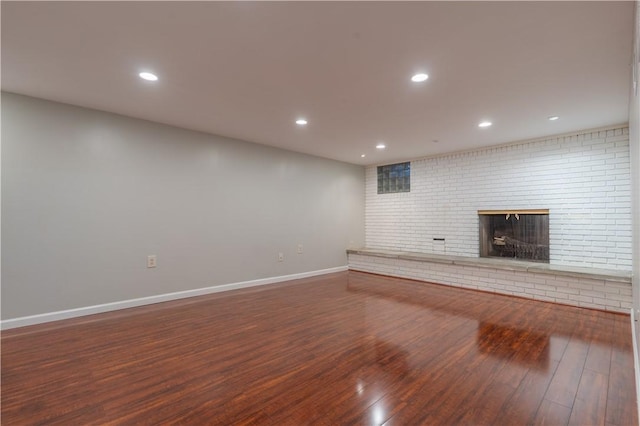 121 Pilgrim Dr, Leet Twp, PA 15143 - unfurnished living room with a brick fireplace, wood finished floors, baseboards, and recessed lighting