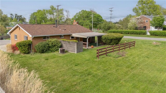 121 Pilgrim Dr, Leet Twp, PA 15143 - rear view of house with a lawn and central air condition unit