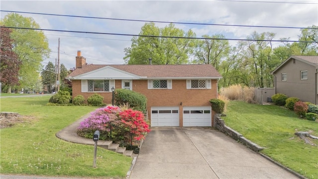 121 Pilgrim Dr, Leet Twp, PA 15143 - view of front facade featuring an attached garage, concrete driveway, a front lawn, and brick siding