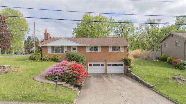 121 Pilgrim Dr, Leet Twp, PA 15143 - view of front of house featuring a garage, concrete driveway, a front lawn, and brick siding