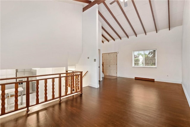 412 Palomino Dr, North Fayette, PA 15071 - unfurnished living room with beam ceiling, wood finished floors, high vaulted ceiling, and baseboards