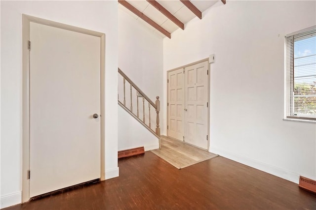 412 Palomino Dr, North Fayette, PA 15071 - foyer entrance with beamed ceiling, wood finished floors, baseboards, high vaulted ceiling, and stairway