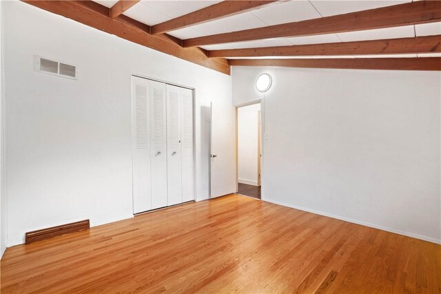 412 Palomino Dr, North Fayette, PA 15071 - unfurnished bedroom with light wood finished floors, beamed ceiling, a closet, and baseboards