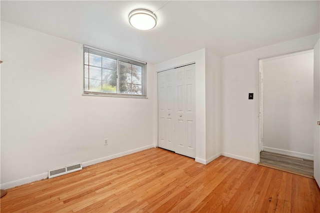 412 Palomino Dr, North Fayette, PA 15071 - unfurnished bedroom featuring baseboards, light wood-style flooring, and a closet