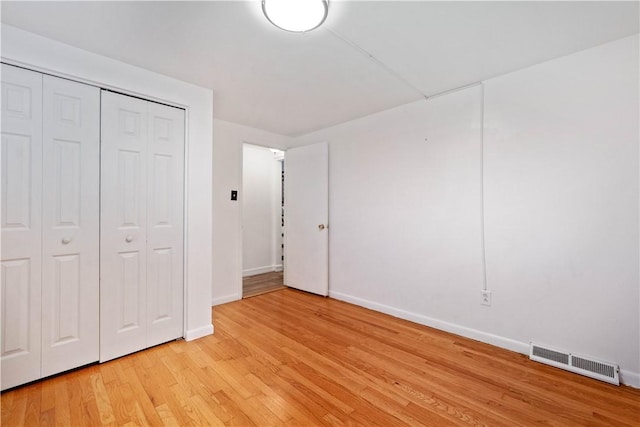 412 Palomino Dr, North Fayette, PA 15071 - unfurnished bedroom with baseboards, light wood-style flooring, and a closet